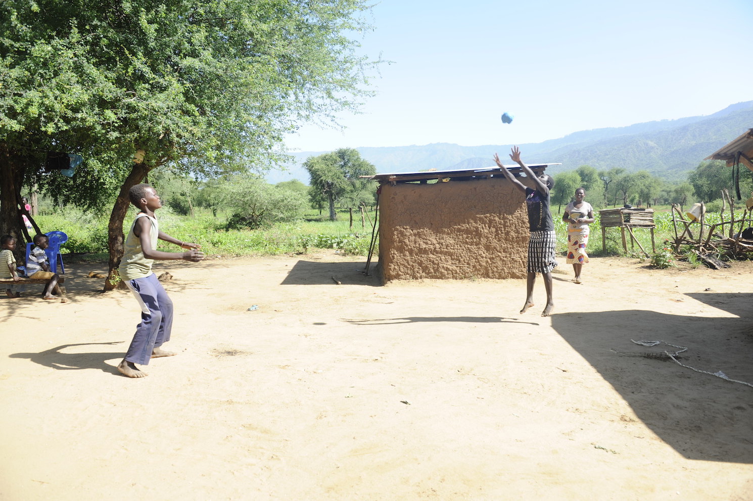 Dennis (16) and his sister Philaris (14)  playing ball at their home in Elgeyo Marakwet County, Kenya. Playtime is helping them beat stress and cope effectively with COVID-19.