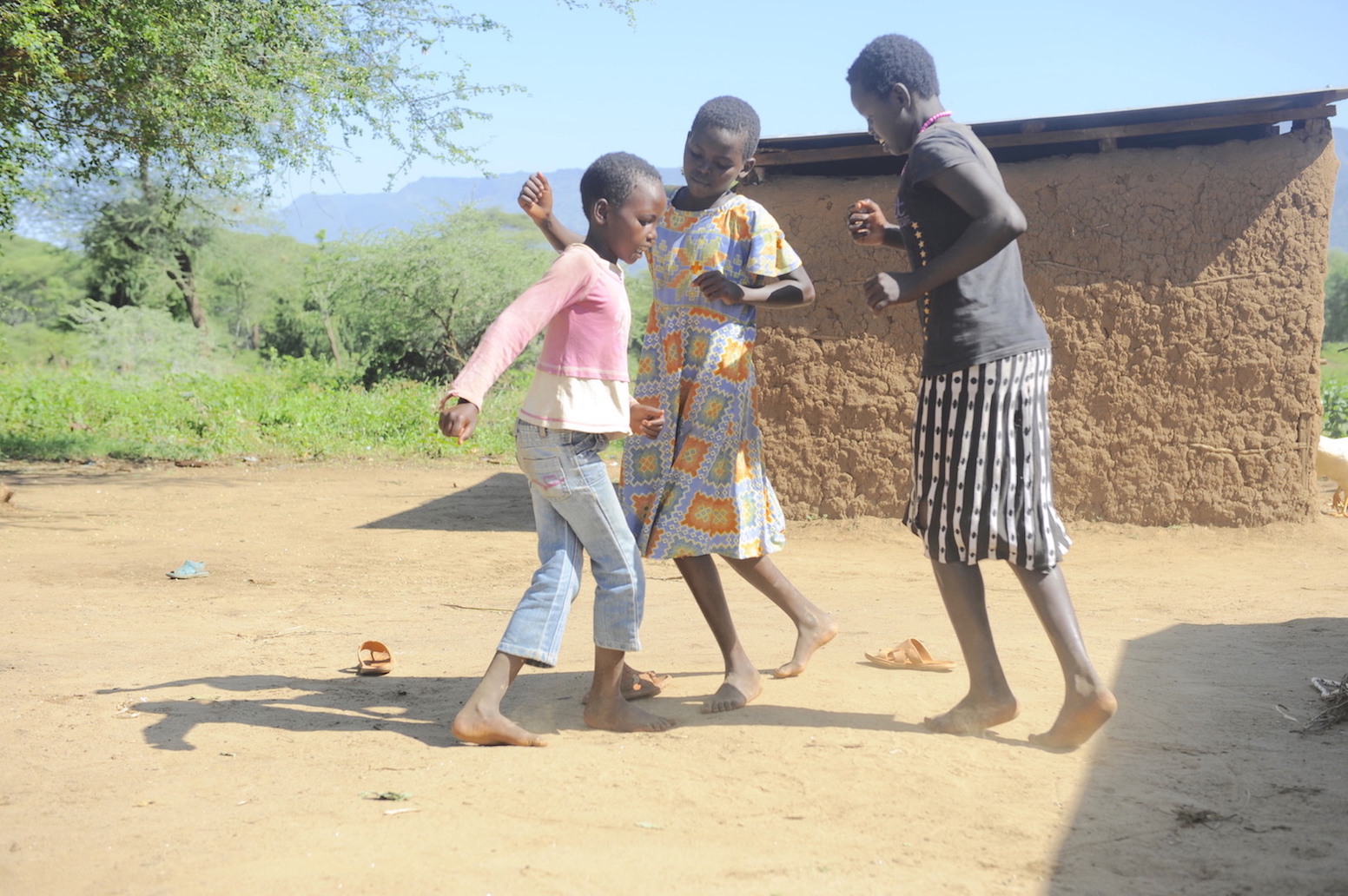 Philaris (14) ,Melvin (12) and Shanice (8) skipping rope at their home in Elgeyo Marakwet County, Kenya. Playtime is helping them beat stress and cope effectively with COVID-19.