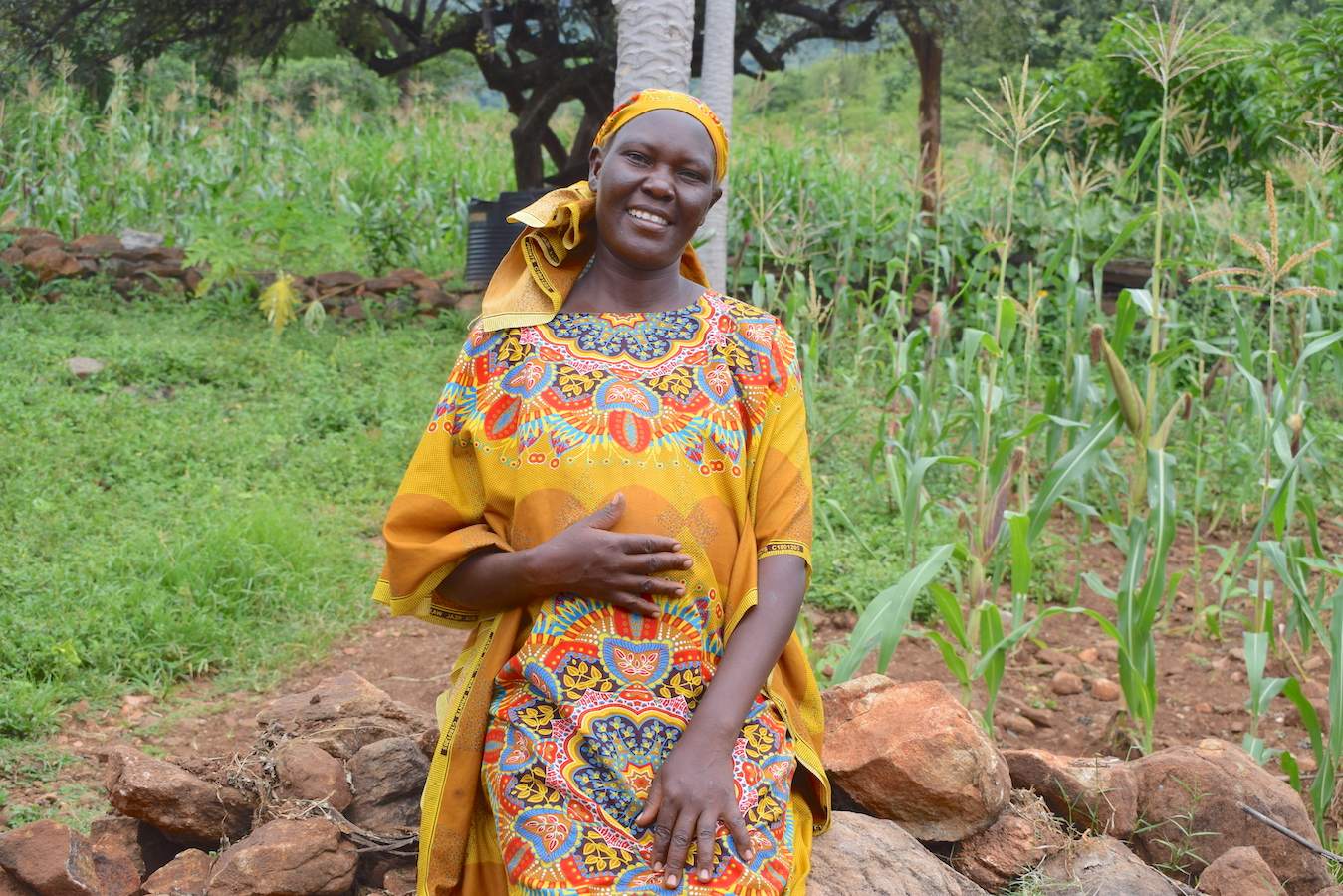 38-year-old Edith (centre) holding her daughter Joy (aged 2). On her left is her daughter Doreen (aged 14) and son Meshack (aged 6) at their home in Elgeyo Marakwet County, Kenya.