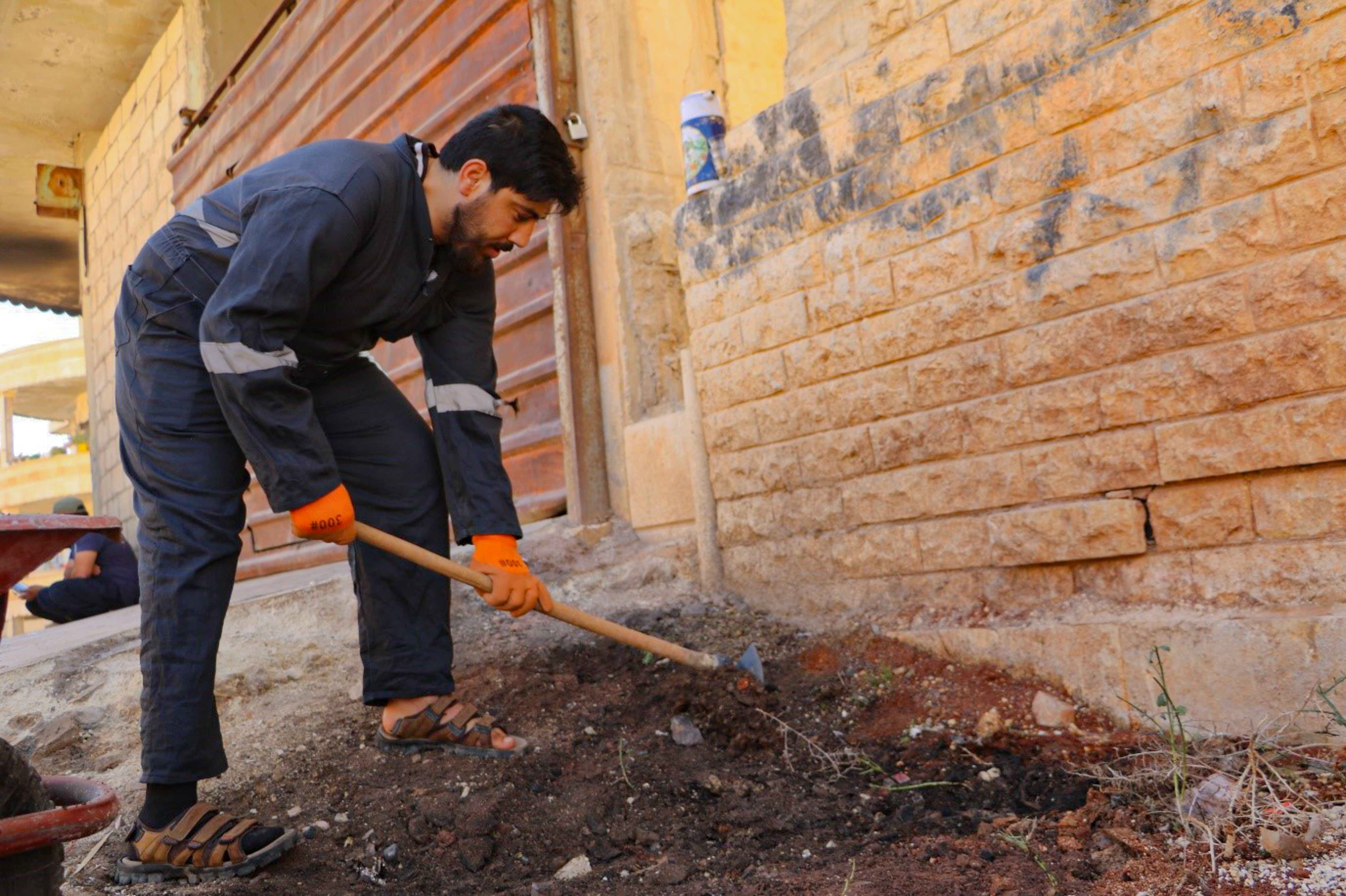 Yaser during the rehabilitation work World Vision Syria Response Partner, Orange