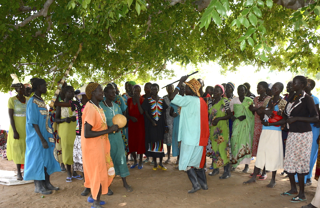 The women celebrate their harvest and hard work together.