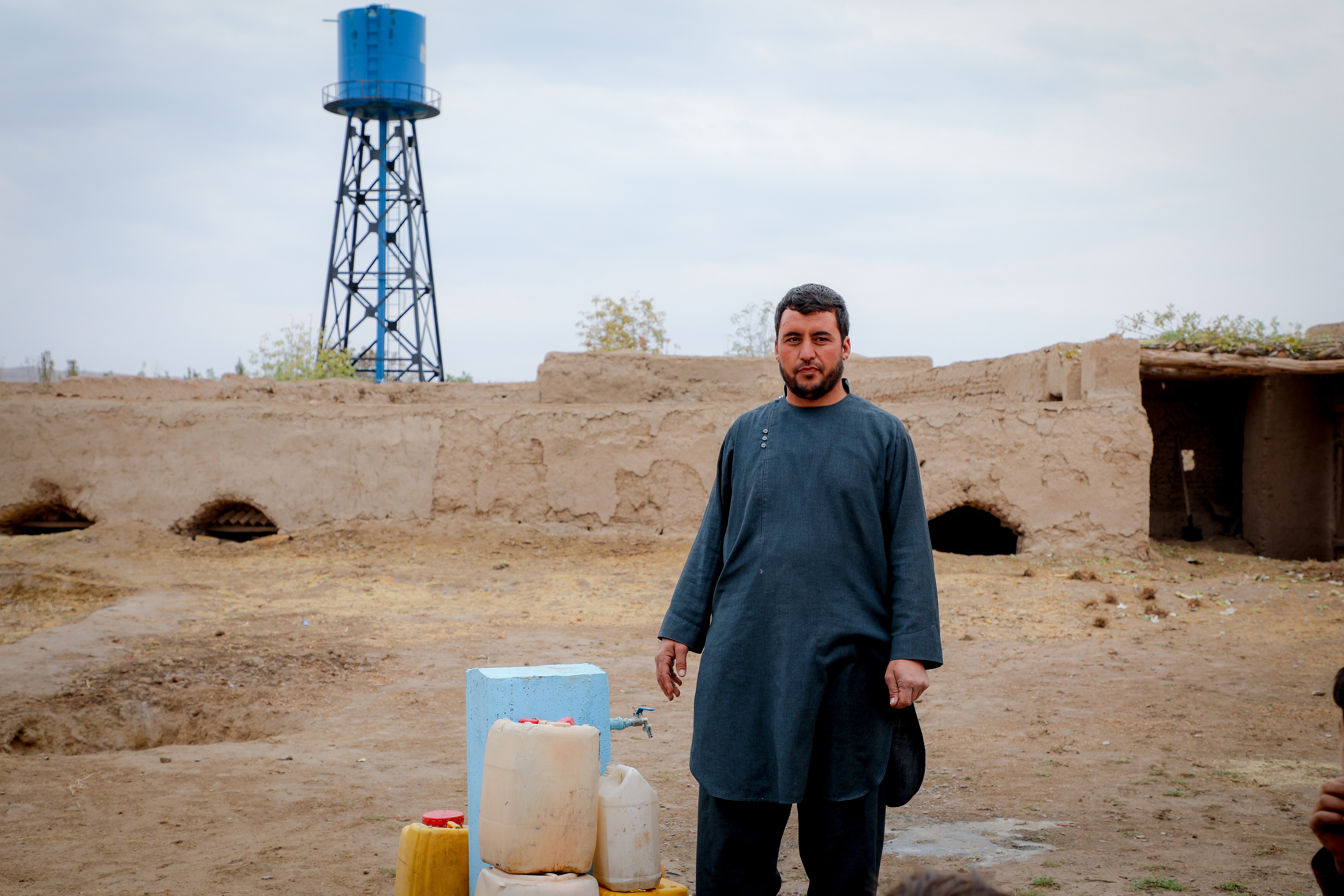 Gul Ahmad is happy for the water tap in his village.