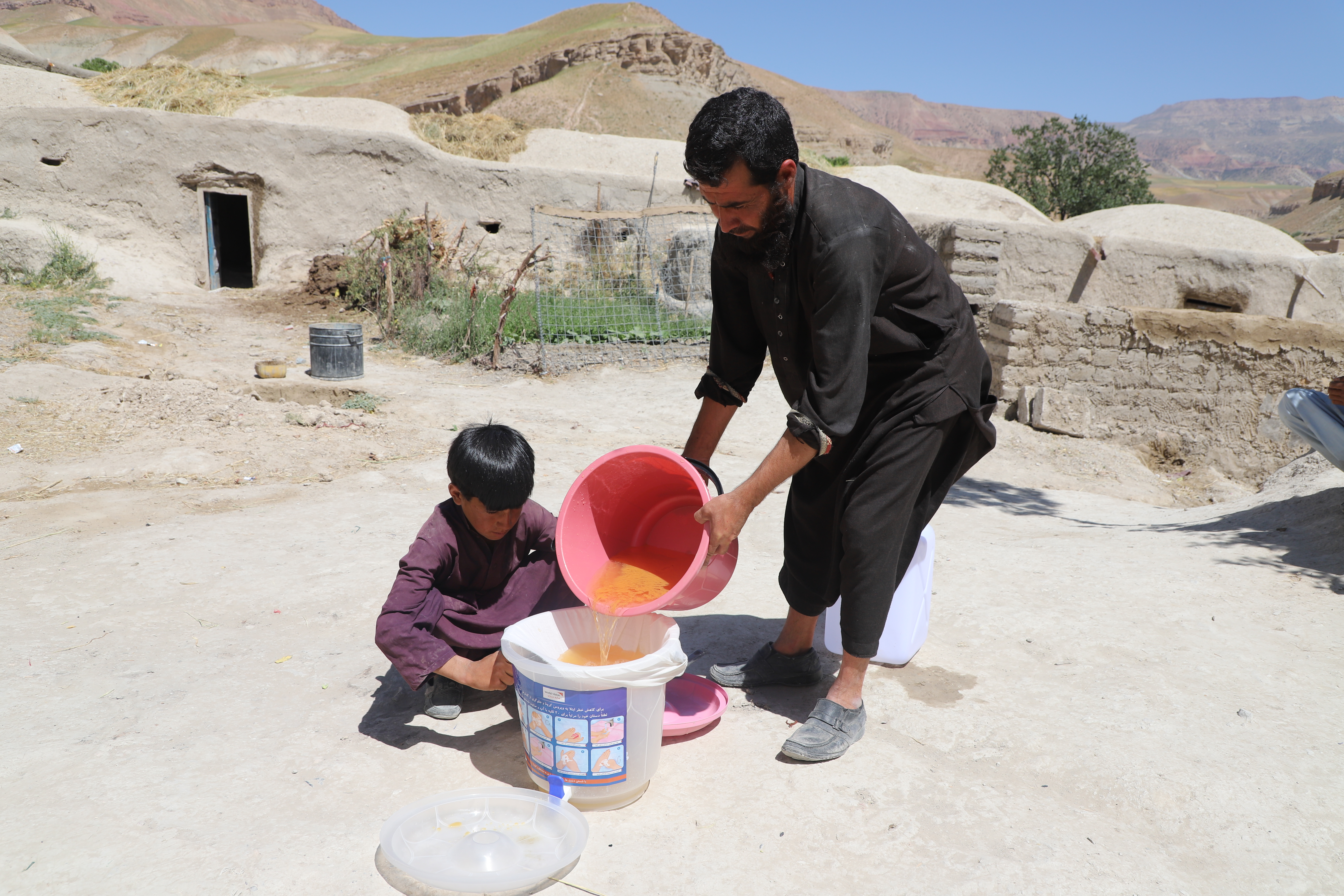 Ghani is using P&G packet  for water purification. 