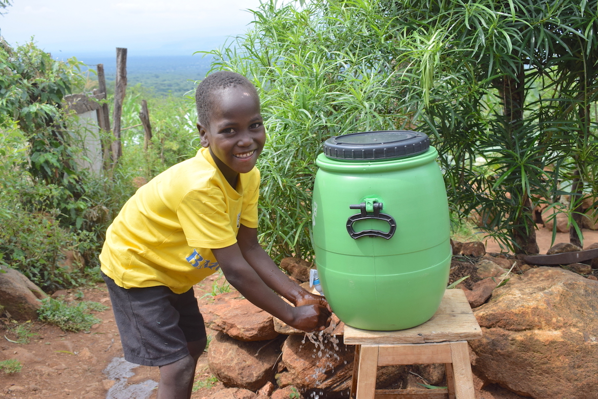 Meshack (aged 6),was taught by her mum Edith how to wash hands with soap effectively so as to prevent COVID-19 at their home in Elgeyo Marakwet County, Kenya.