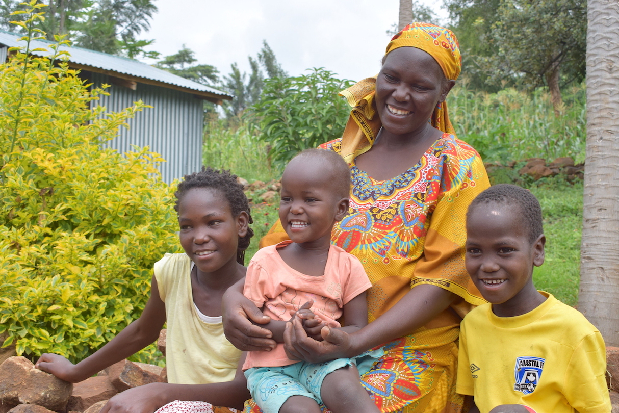 38-year-old Edith (centre) holding her daughter Joy (aged 2). On her left is her daughter Doreen (aged 14) and son Meshack (aged 6) at their home in Elgeyo Marakwet County, Kenya.