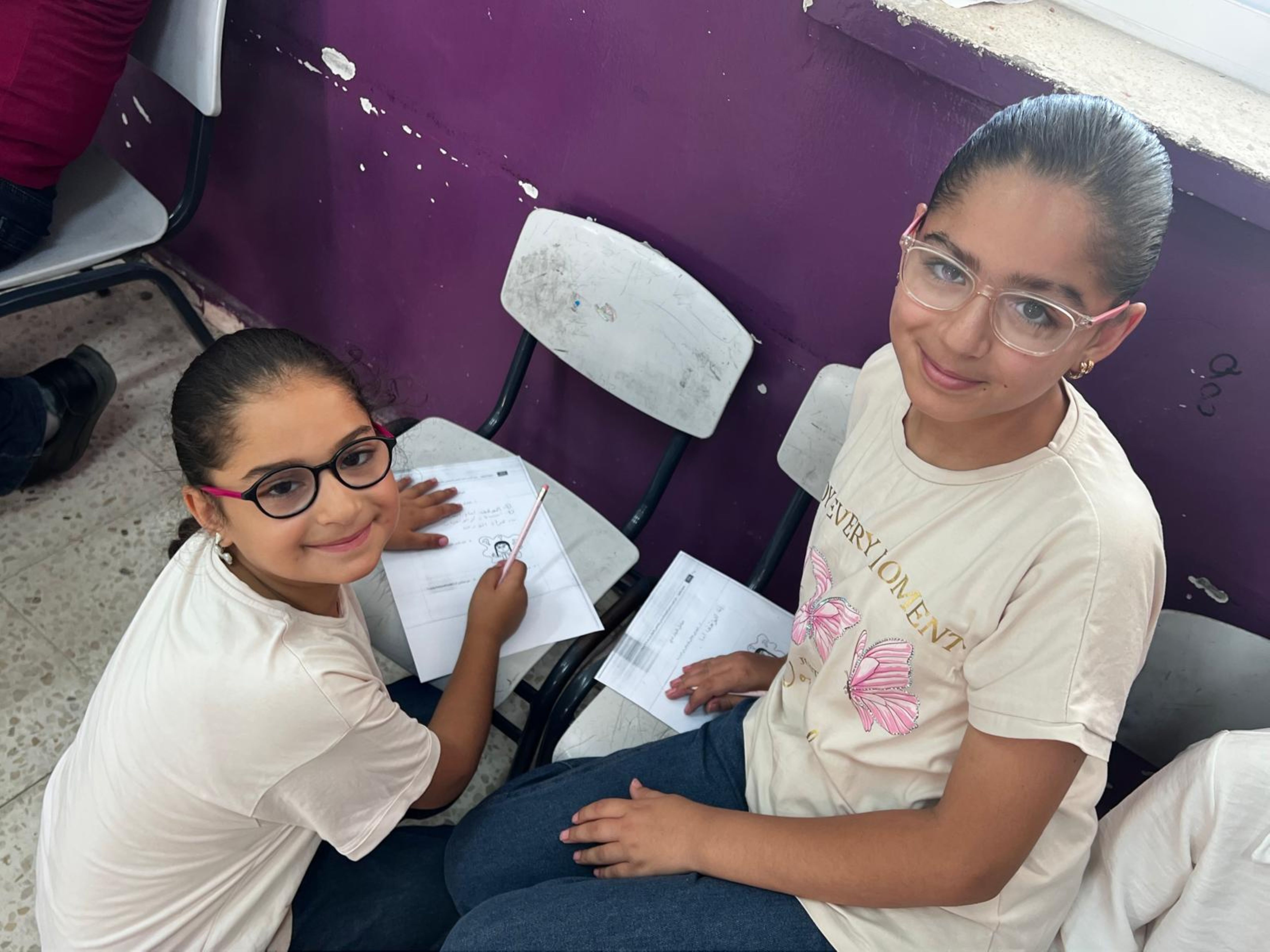 Farah expresses her thoughts and feelings through a drawing activity during a Makani Club session, helping her build confidence and strengthen her self-expression.