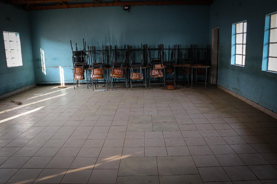 Furniture stacked in a classroom at Tshabili Secondary School 