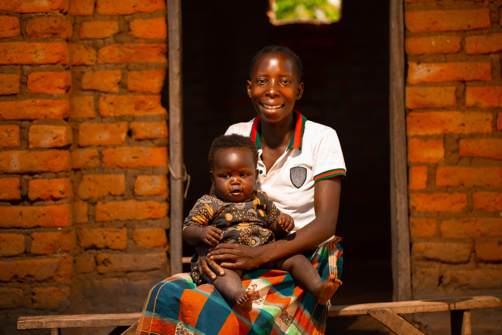 Alice Moses holding her 6 months old baby