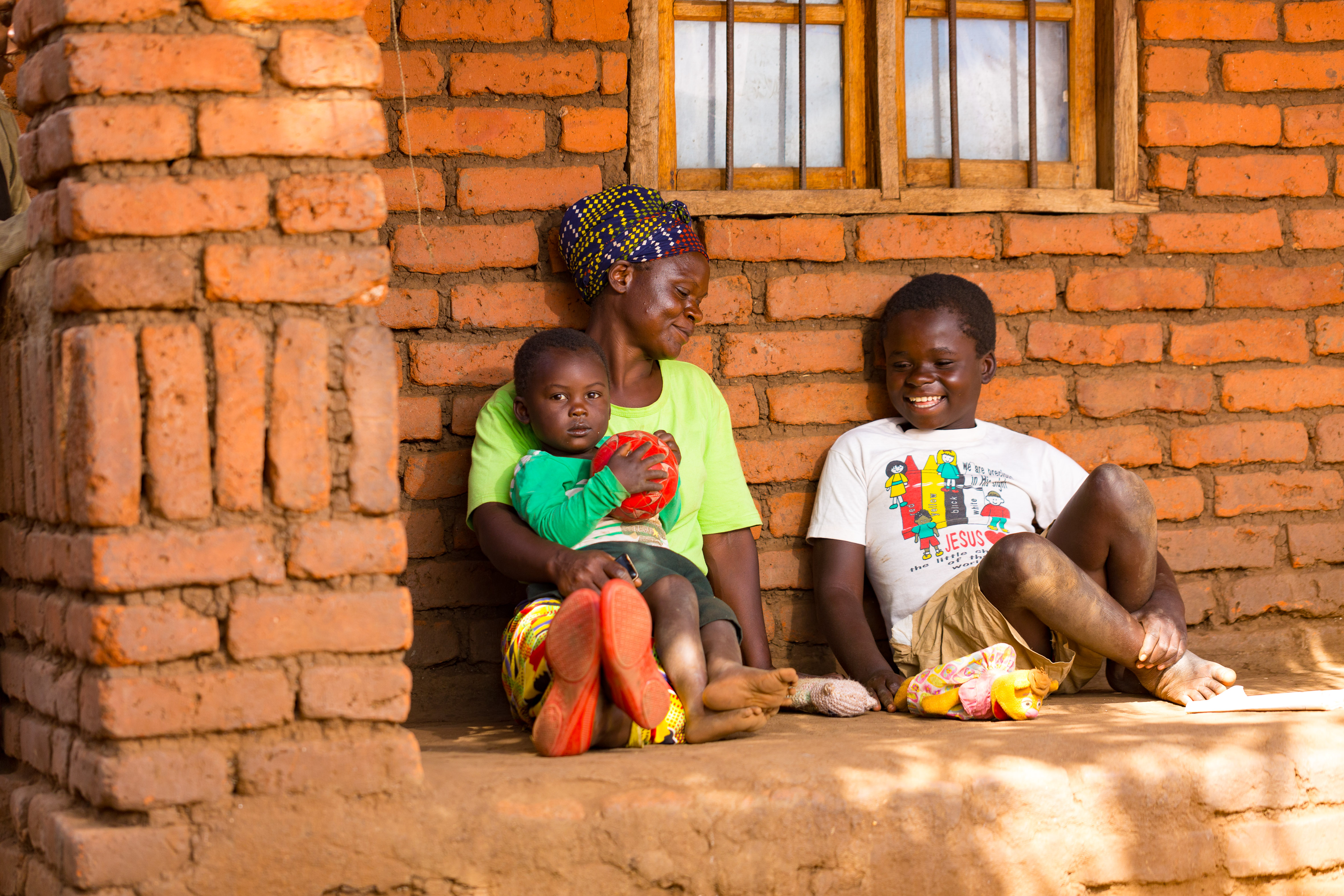 Chancy and his mother, Seketeni, outside their house.