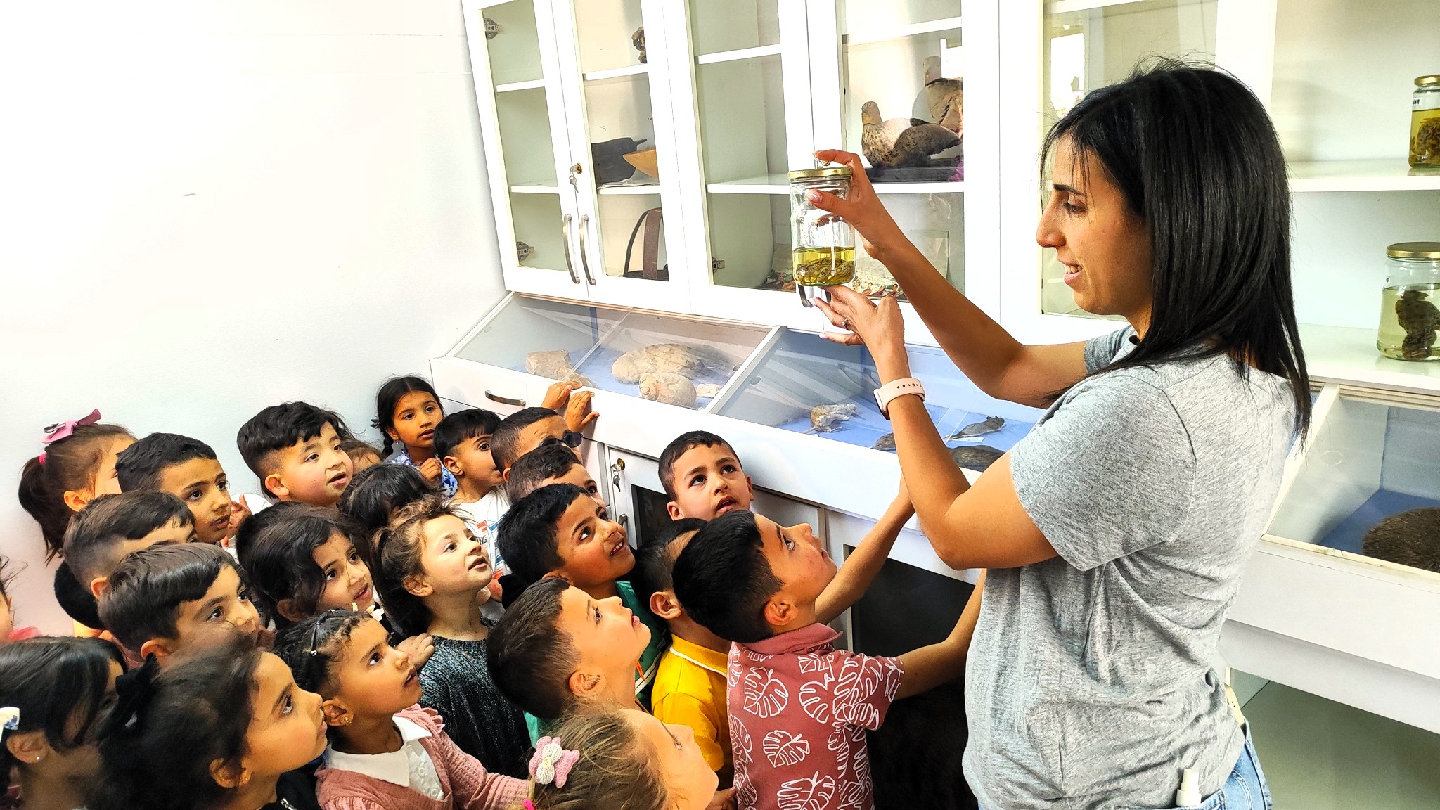 A group of students is learning about the biodiversity of the West Bank