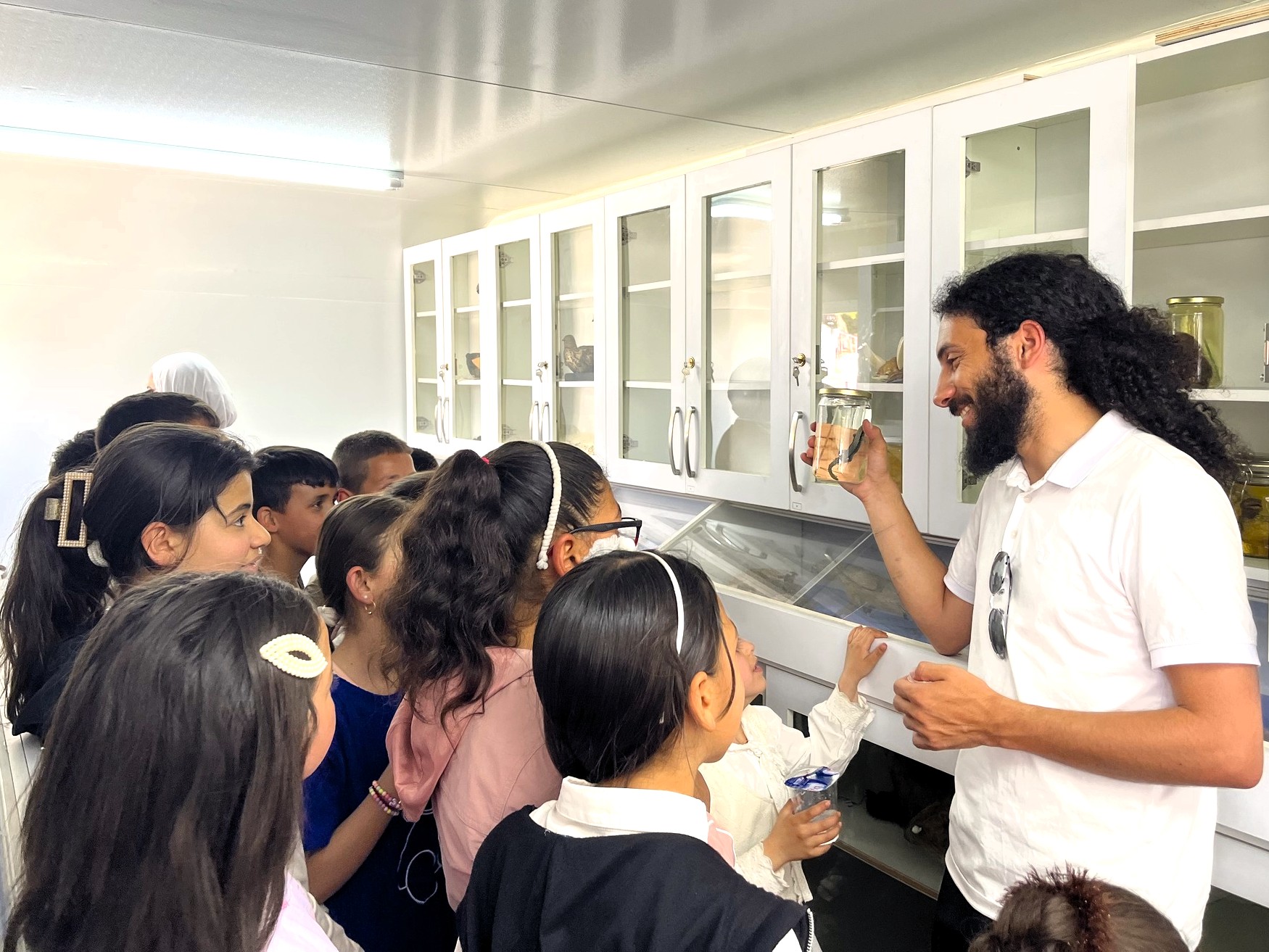 A group of students is learning about the biodiversity of the West Bank