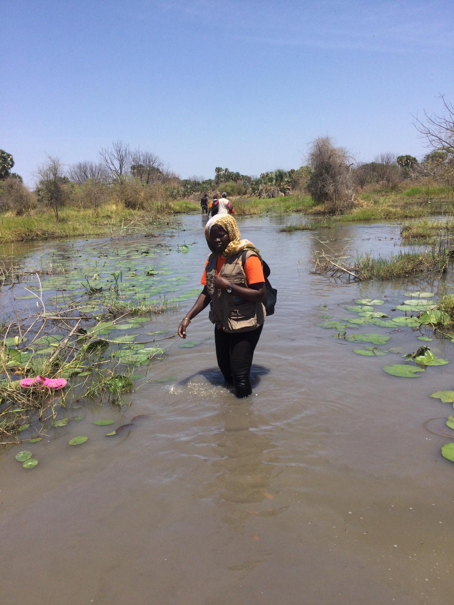 Bridget wades through flood waters in one of World Vision’s emergency response operations.