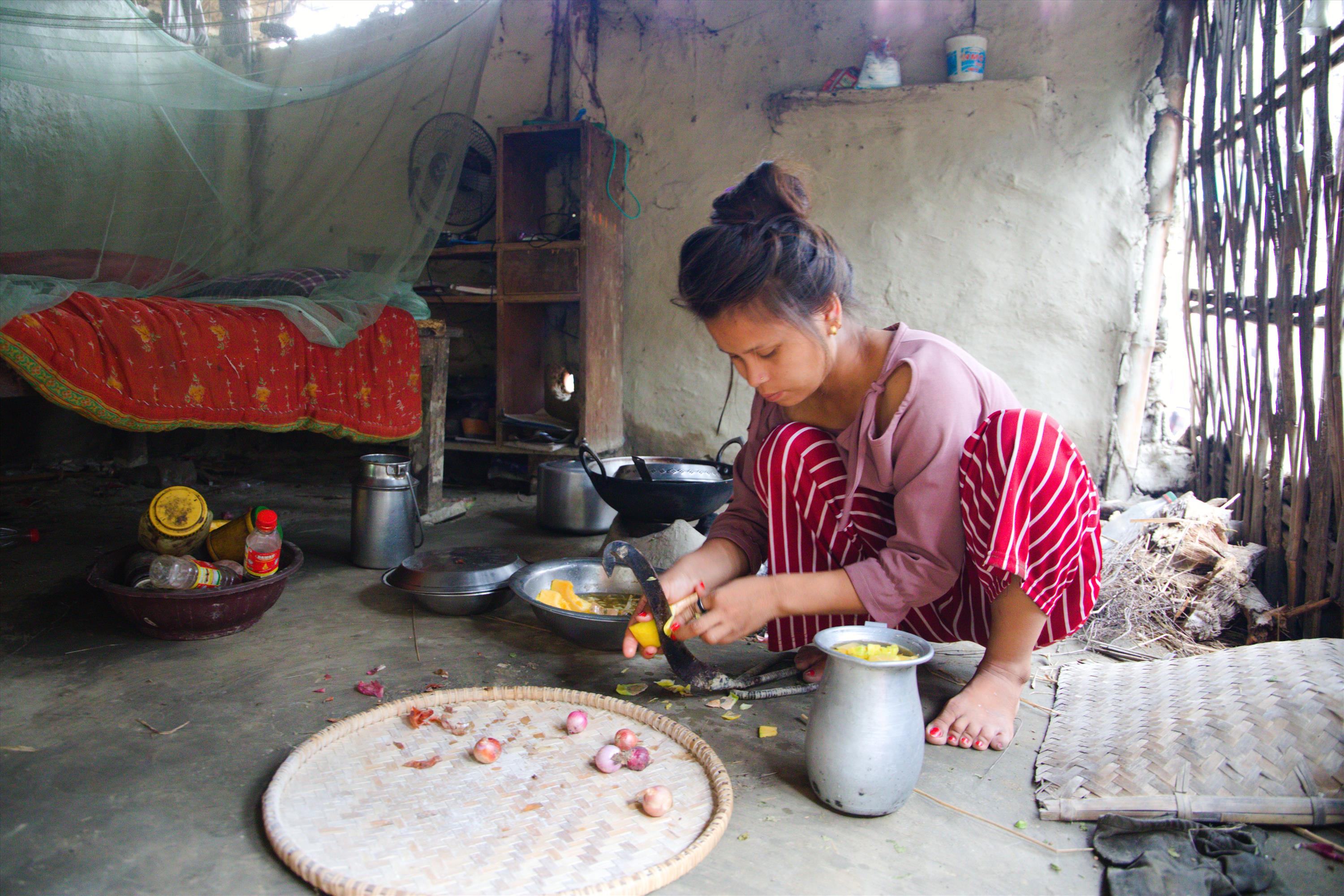 Prabha prepares food for her family