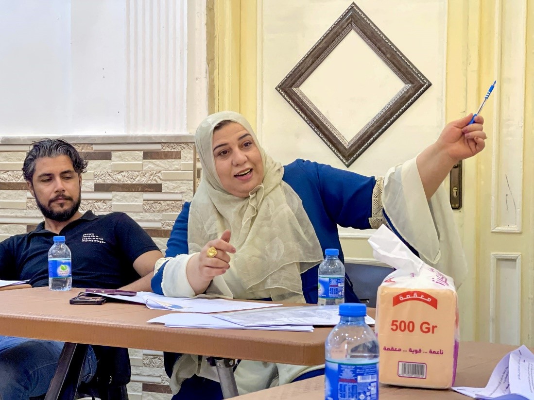 Photo of Thuraya* confidently participating in the dialogue sessions, taken by partner, Aid Gate Organization.
