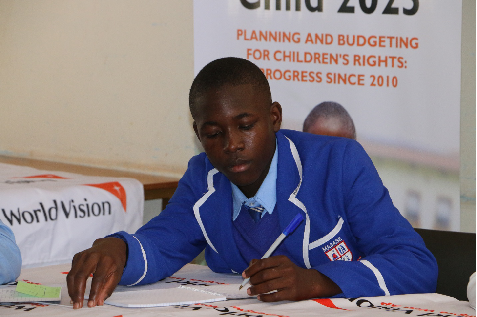 Student takes note during a presentation