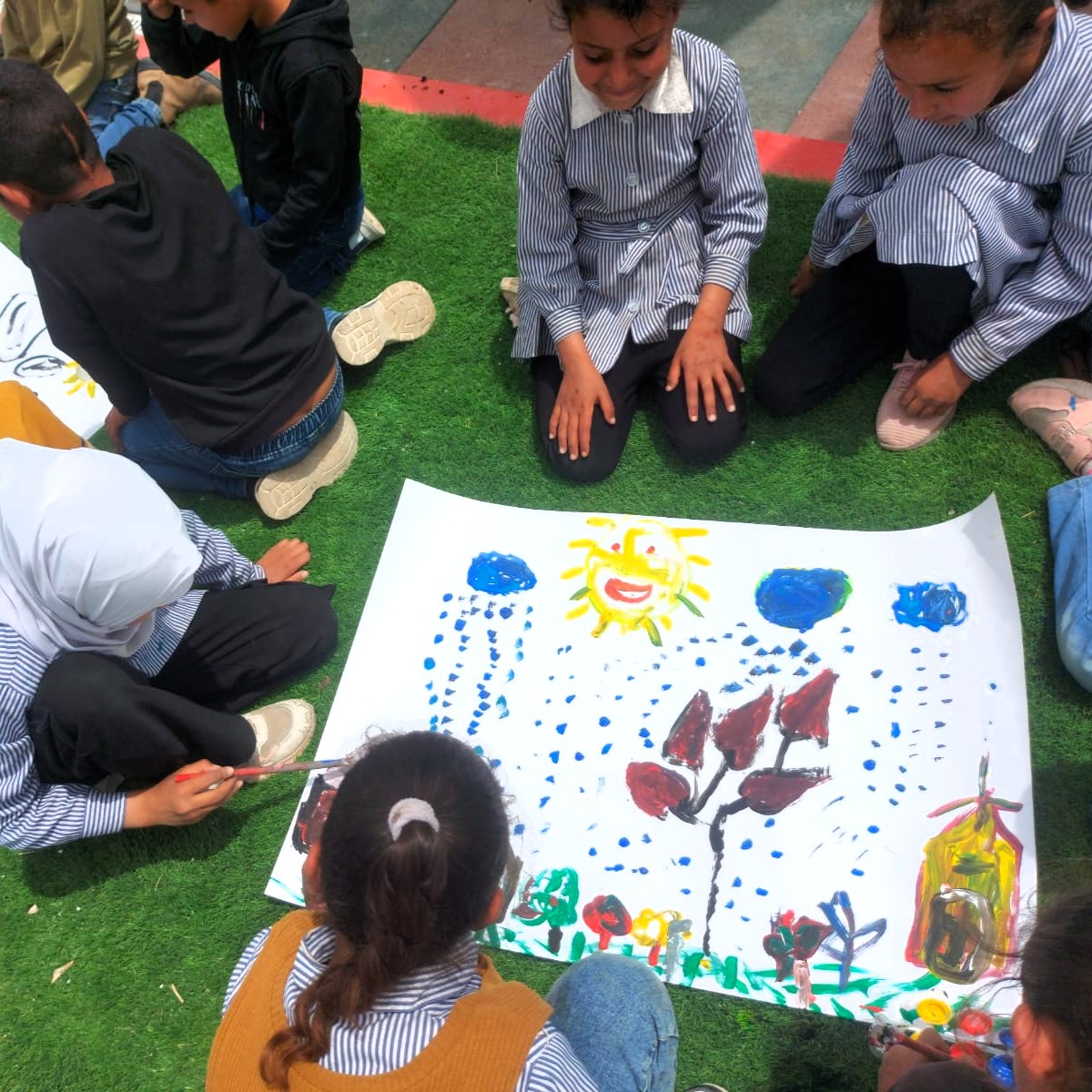 Students are attending an art class in the new playground