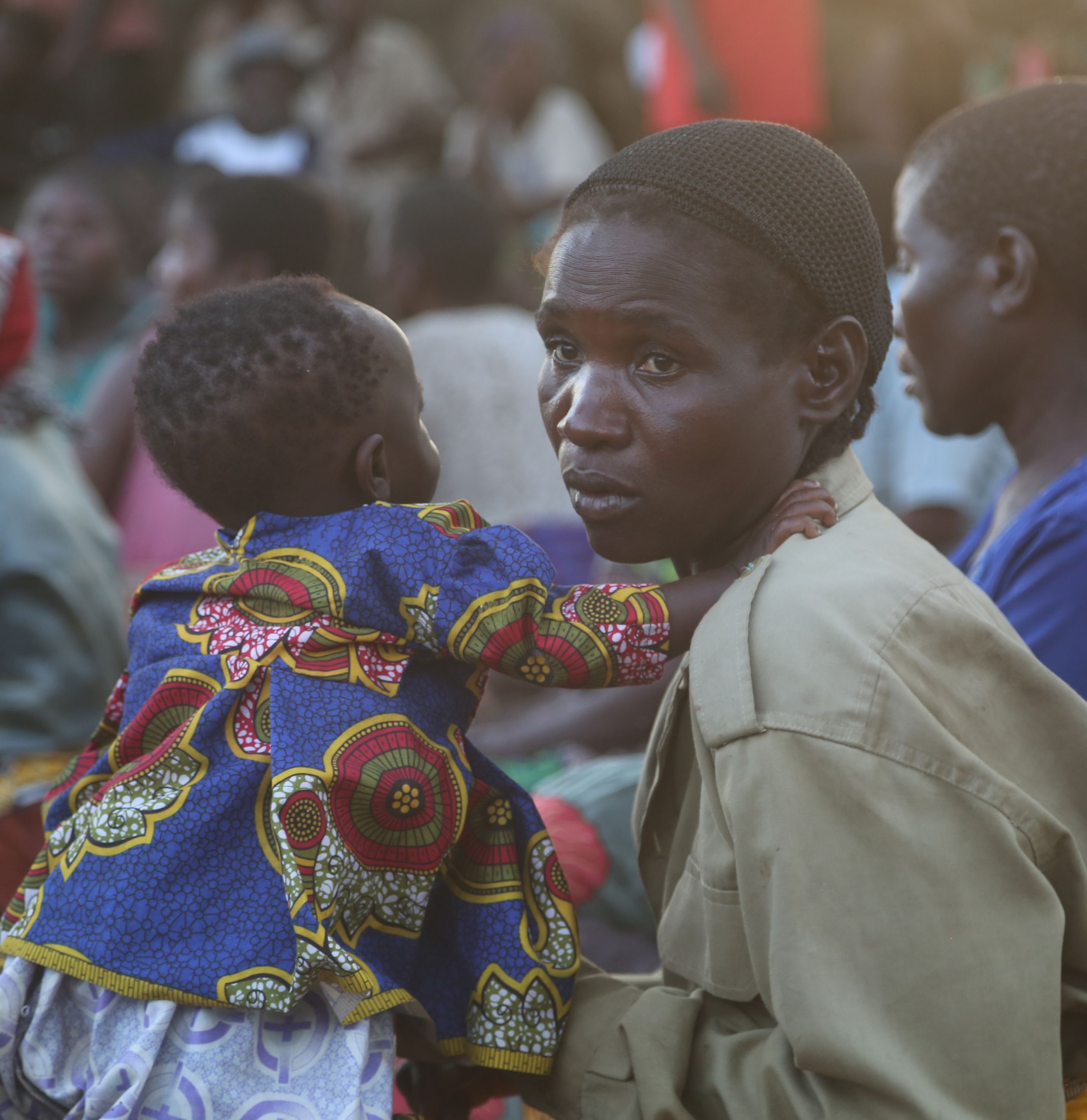 <alt="World Vision staff member with 4 girls impacted by Richter earthquake">