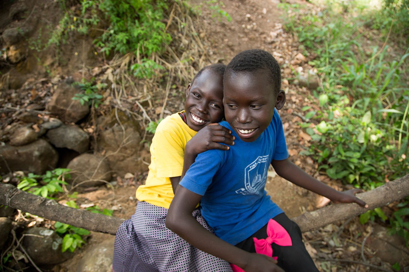 Two child refugees smiling