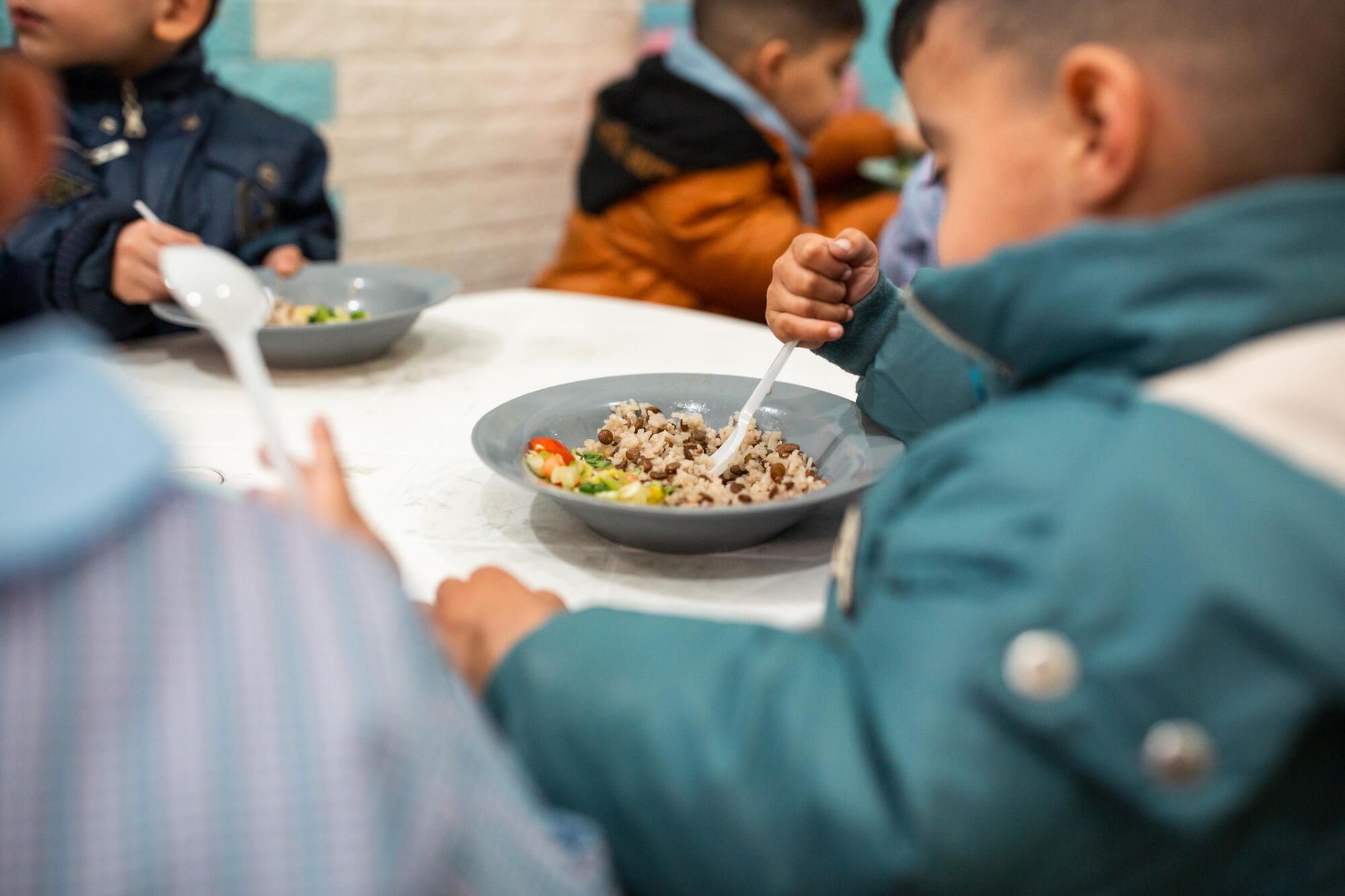 Young boy eating nutritous school meal