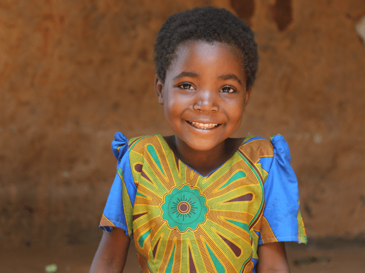 Smiling girl wearing a colorful shirt