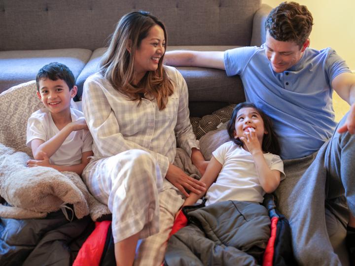 Family of four sitting together