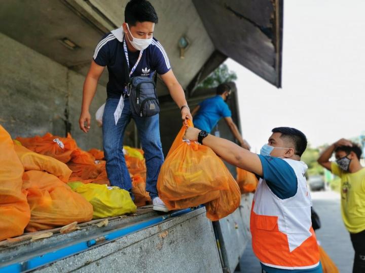 World Vision staff with emergency supplies