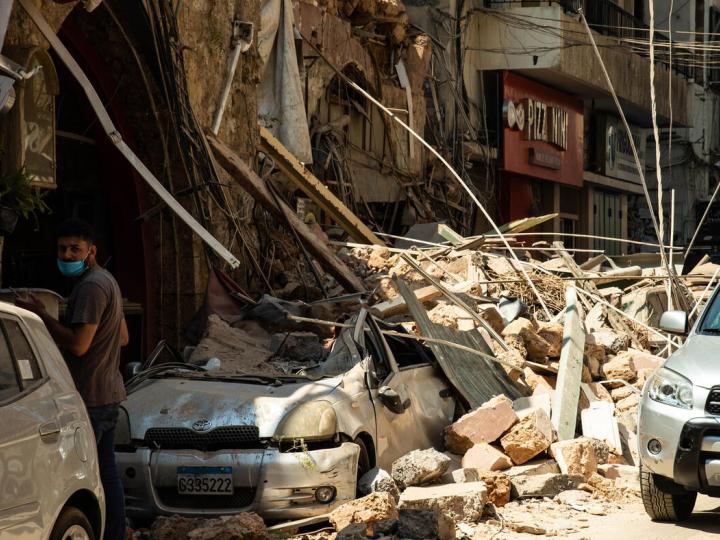 car and building smashed by explosion in Beirut, Lebanon