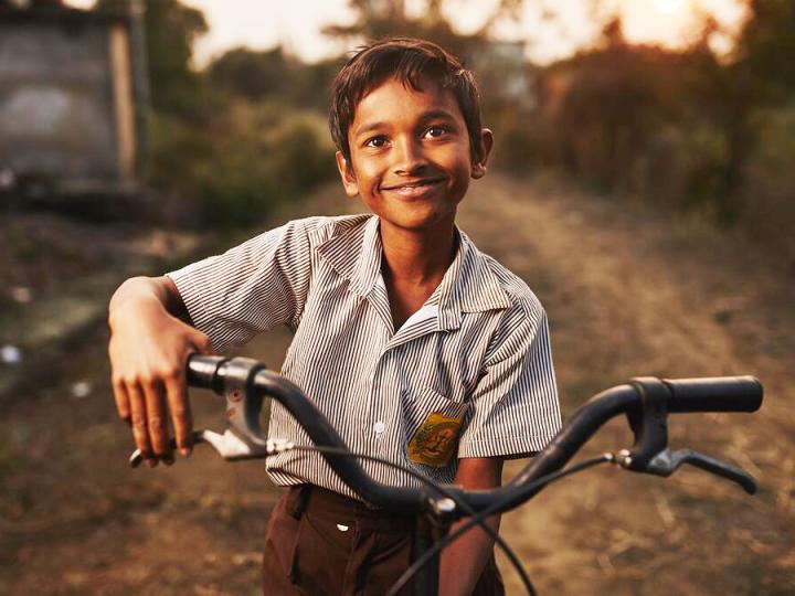 A world of firsts child with bicycle 