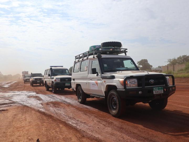 The Shrinking Humanitarian Space, World Vision vehicles in Convoy