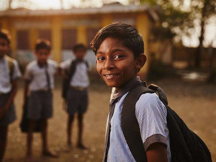 Boy with backpack in Asia