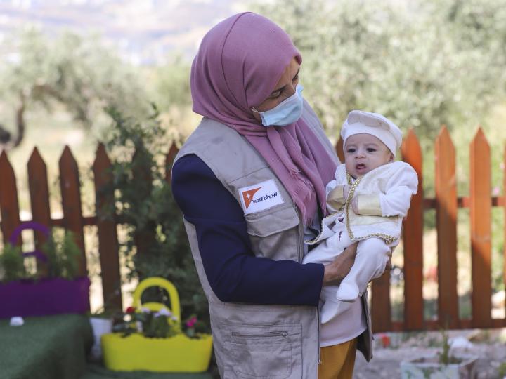 World Vision JWG COVID-19 response - CHW with baby 2