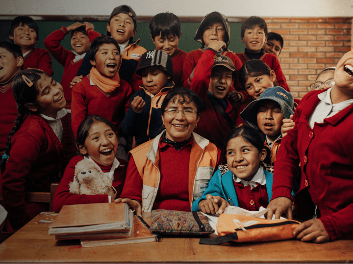 World Vision Staff Doris with children in classroom