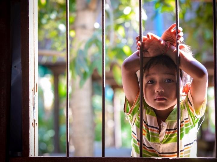 Young boy outside childrens club Cambodia