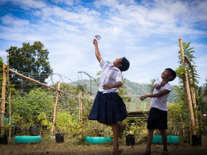 two children play in school yard