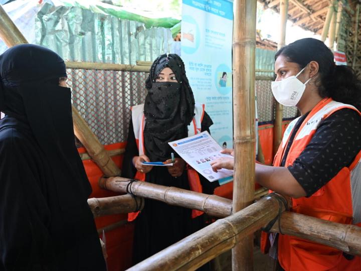 World Vision Staff speaks to women