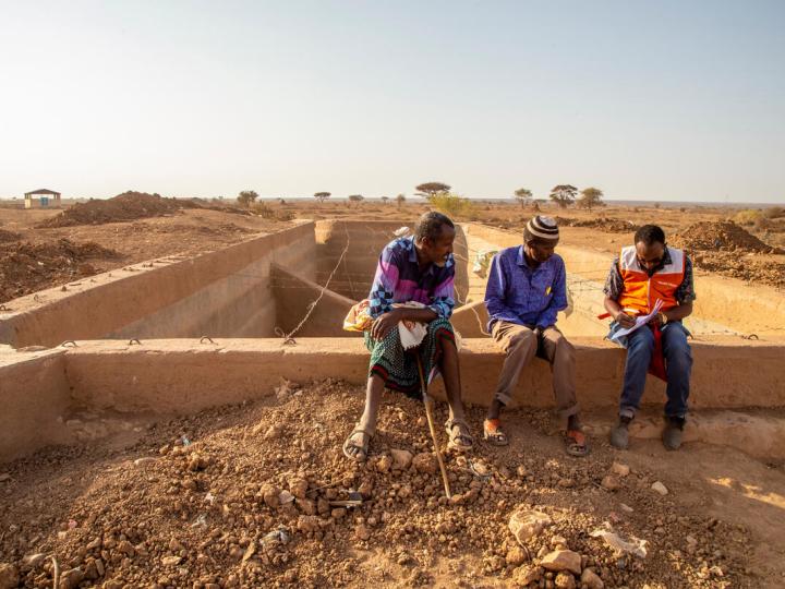 WVI staff speaks with villagers
