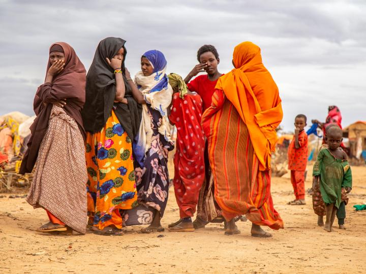 Displaced women walking