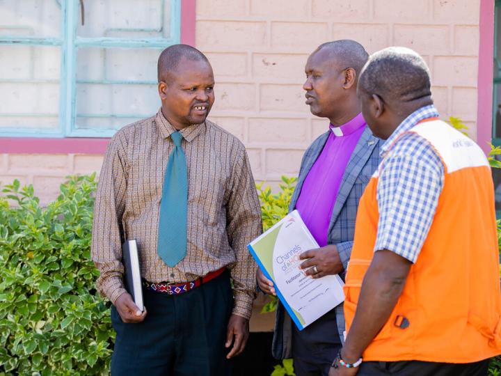 World Vision staff member talks with pastors in Kenya