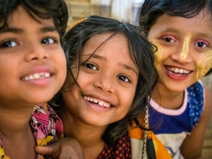 Three children smiling