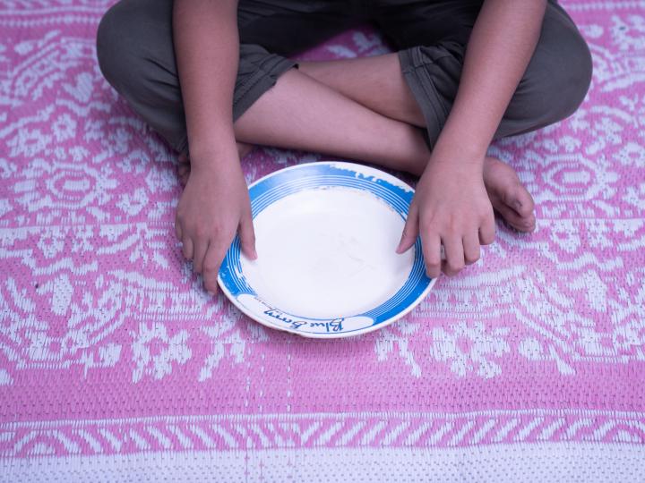 a boy with his empty plate