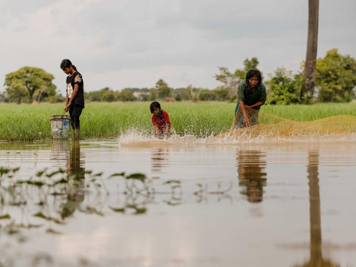 Sambath and Laum from Cambodia, fishing with their grandmother