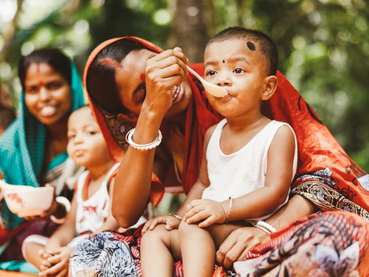 Mother feeding child