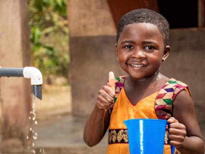 happy child with access to clean water