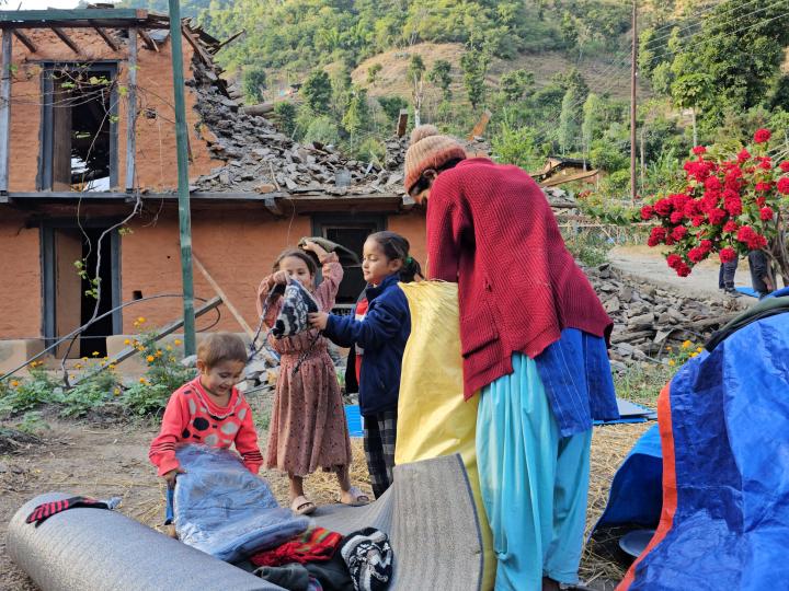 Children look at the items received from WVI Nepal