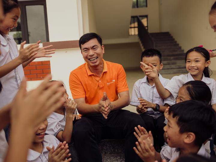 World Vision Vietnam staff with children