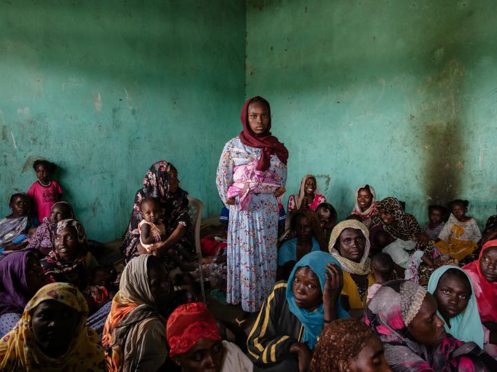 A girl standing in the middle of El Ferdouse clinic