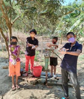 Children teaching other hand-washing 