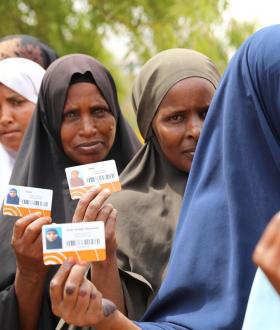 IDPs and drought-affected beneficiaries lining up to receive a cash distribution from World Vision and its CCD partners in Somali region, Ethiopia, as part of our humanitarian disaster management team's cash and voucher assistance programming promoting dignity for people affected by emergencies, providing them with choice, dignity, and flexibility while helping build resilience, by driving the recovery of local markets.