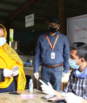 Laboni, 26, a single mother, receives cash grant support from World Vision. 