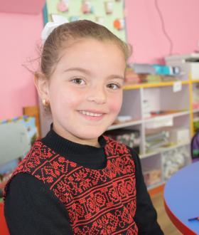 Girl in school in the West Bank in traditional Palestinian dress
